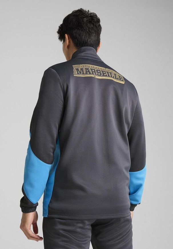 Puma - Męska rozpinana kurtka Olympique de Marseille ftblNRGY+ PUMA. Kolor: beżowy, wielokolorowy, szary. Wzór: aplikacja