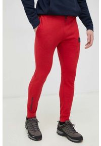 Helly Hansen spodnie dresowe kolor czerwony gładkie. Kolor: czerwony. Materiał: dresówka. Wzór: gładki