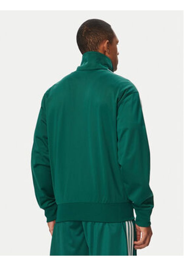 Adidas - adidas Bluza Firebird KD8314 Zielony Loose Fit. Kolor: zielony. Materiał: syntetyk