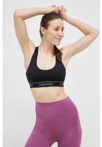 Calvin Klein Performance biustonosz sportowy CK Athletic kolor czarny gładki. Kolor: czarny. Materiał: materiał. Rodzaj stanika: wyciągane miseczki. Wzór: gładki. Sport: fitness, taniec #5