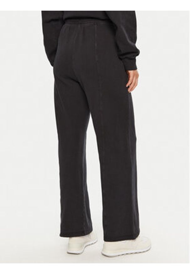 Champion Spodnie dresowe 117638 Czarny Wide Leg. Kolor: czarny. Materiał: bawełna