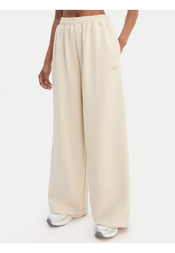 Reebok Spodnie dresowe Reebok x Ewa Chodakowska RK25624CCW Beżowy Wide Leg. Kolor: beżowy. Materiał: syntetyk