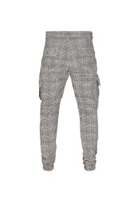 Urban Classics - Męskie Spodnie Joggingowe Glencheck Z Nadrukiem Na Całej Powierzchni. Kolor: czarny, biały, wielokolorowy. Długość: długie. Wzór: nadruk