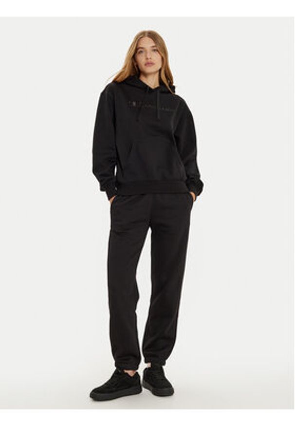 Champion Spodnie dresowe 117583 Czarny Regular Fit. Kolor: czarny. Materiał: bawełna