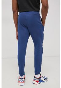 Reebok Spodnie HA1071 męskie z aplikacją. Kolor: niebieski. Materiał: poliester, materiał, dzianina. Wzór: aplikacja #3
