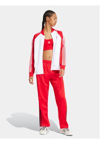 Adidas - adidas Spodnie dresowe adicolor Classics SST IM9809 Czerwony Loose Fit. Kolor: czerwony. Materiał: syntetyk