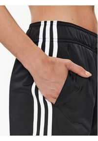 Adidas - adidas Spodnie dresowe Essentials Warm-Up 3-Stripes H48451 Czarny Regular Fit. Kolor: czarny. Materiał: syntetyk #6