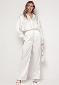 Born2be - Białe Szerokie Spodnie z Metalicznym Wzorem w Cienkie Paski Kleriame. Kolor: biały. Wzór: paski #5