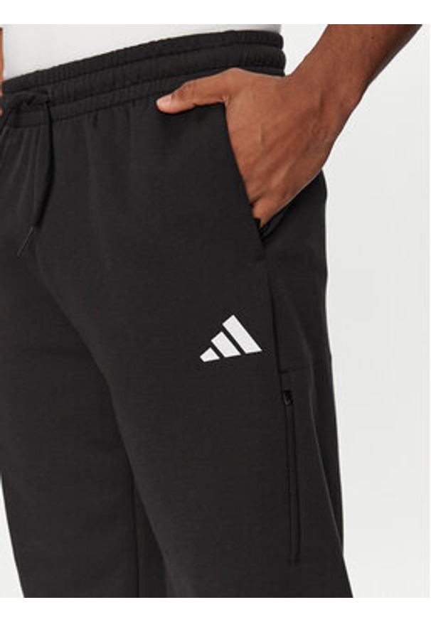 Adidas - adidas Spodnie dresowe Future Icons 3-Stripes JD4889 Czarny Loose Fit. Kolor: czarny. Materiał: syntetyk, bawełna