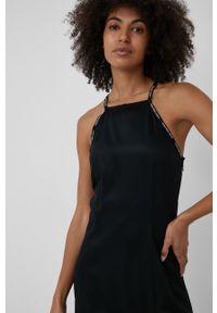 Calvin Klein Jeans sukienka kolor czarny mini rozkloszowana. Kolor: czarny. Materiał: tkanina. Długość rękawa: na ramiączkach. Wzór: gładki. Typ sukienki: rozkloszowane. Długość: mini