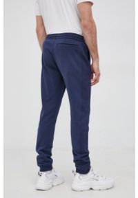 Calvin Klein Jeans Spodnie bawełniane męskie kolor granatowy gładkie. Kolor: niebieski. Materiał: bawełna. Wzór: gładki