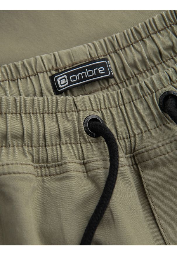 Ombre Clothing - Męskie spodnie JOGGERY z zapinanymi kieszeniami cargo - khaki V1 OM-PAJO-0125 - XXL. Okazja: na co dzień. Kolor: brązowy. Materiał: bawełna, elastan. Wzór: aplikacja. Styl: casual