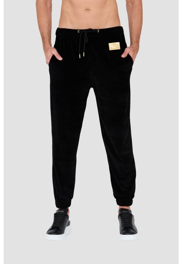 MOSCHINO Czarne welurowe spodnie dresowe. Kolor: czarny. Materiał: dresówka, welur