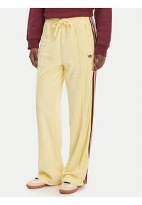 Adidas - adidas Spodnie dresowe Terry Towel Firebird KQ6662 Żółty Loose Fit. Kolor: żółty. Materiał: bawełna #1