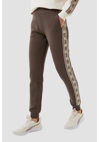 Guess - GUESS Brązowe damskie spodnie dresowe Britney Jogger, Rozmiar XS. Kolor: brązowy. Materiał: dresówka. Długość: długie