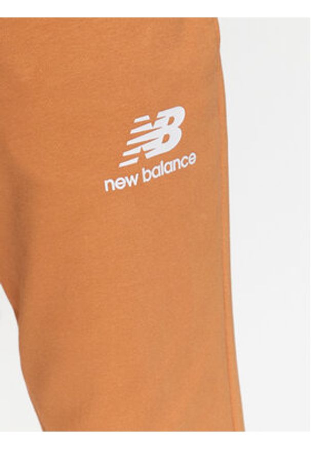 New Balance Spodnie dresowe MP31539 Żółty Regular Fit. Kolor: żółty. Materiał: syntetyk