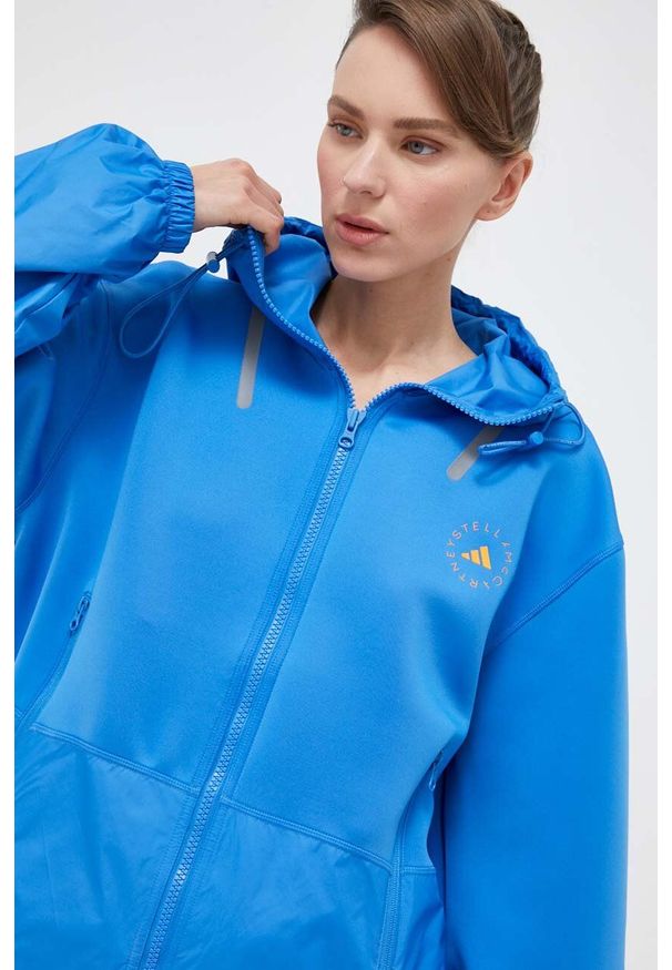 Adidas by Stella McCartney - adidas by Stella McCartney kurtka sportowa kolor niebieski przejściowa oversize. Kolor: niebieski. Materiał: materiał. Styl: sportowy