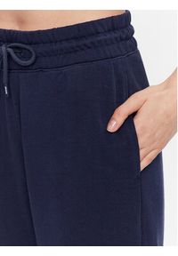 Tommy Jeans Spodnie dresowe DW0DW15370 Granatowy Loose Fit. Kolor: niebieski. Materiał: dresówka, bawełna