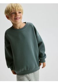 Reserved - Bluza oversize z nadrukiem - zielony. Kolor: zielony. Materiał: dzianina. Wzór: nadruk