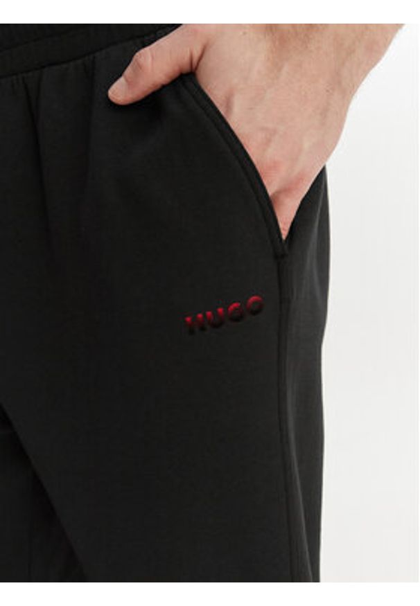 Hugo - HUGO Spodnie dresowe Atlas 50557004 Czarny Regular Fit. Kolor: czarny. Materiał: bawełna