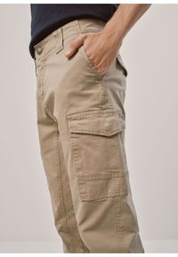 Ochnik - Beżowe spodnie męskie cargo. Kolor: beżowy. Materiał: bawełna #4