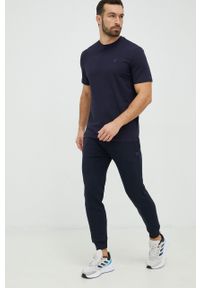 Guess spodnie dresowe kolor granatowy melanżowe. Kolor: niebieski. Materiał: dresówka. Wzór: melanż #4