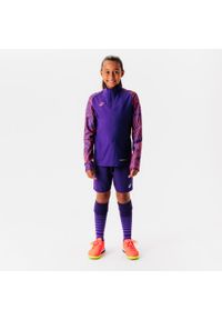KIPSTA - Bluza piłkarska na krótki suwak dla dzieci Kipsta Viralto Wavy Club. Kolor: fioletowy, wielokolorowy, różowy. Materiał: poliester, materiał, elastan. Długość: krótkie. Sport: piłka nożna