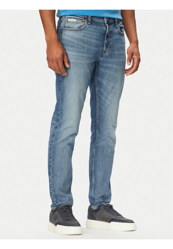 Calvin Klein Jeans Jeansy LV04RF742G Niebieski Tapered Fit. Kolor: niebieski