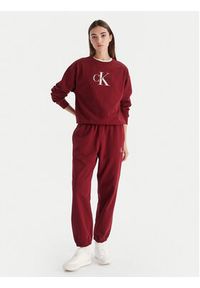 Calvin Klein Jeans Spodnie dresowe Monologo LV047B235G Bordowy Regular Fit. Kolor: czerwony. Materiał: bawełna