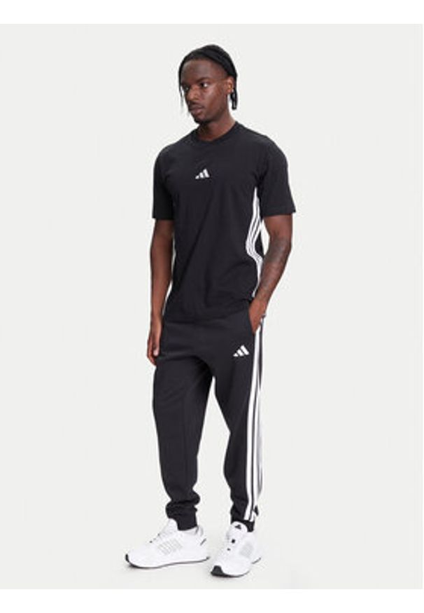 Adidas - adidas Spodnie dresowe Essentials 3-Stripes JD1861 Czarny Regular Fit. Kolor: czarny. Materiał: bawełna, syntetyk