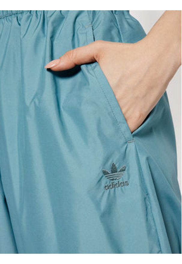 Adidas - adidas Spodnie dresowe adicolor 3D Trefoil GN2850 Zielony Loose Fit. Kolor: zielony. Materiał: syntetyk, dresówka