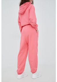 Tommy Jeans spodnie DW0DW11886.PPYY damskie kolor różowy gładkie. Kolor: różowy. Materiał: materiał, dzianina. Wzór: gładki #6