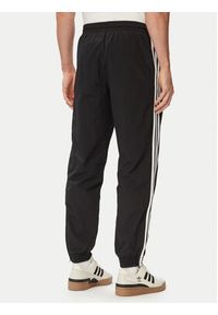 Adidas - adidas Spodnie dresowe Firebird Woven KE1371 Czarny Regular Fit. Kolor: czarny. Materiał: syntetyk #3