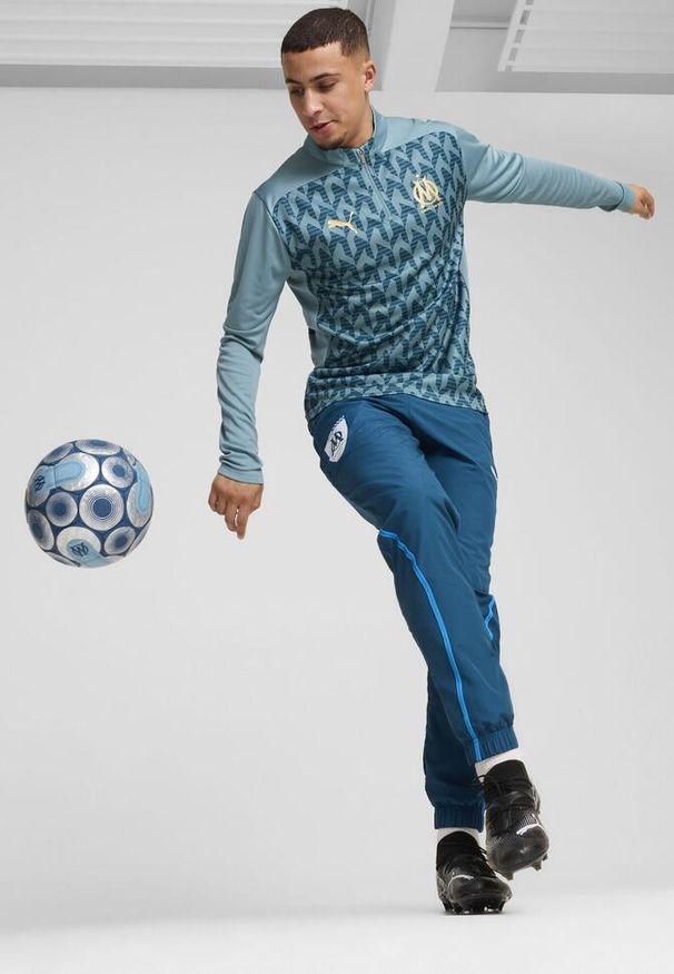 Puma - Męska bluza przedmeczowa z zamkiem 1/4 Olympique Marsylia PUMA. Kolor: niebieski. Długość rękawa: krótki rękaw. Długość: krótkie. Wzór: aplikacja