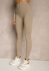 Renee - Beżowy Komplet Sportowy Legginsy i Top Typu Longsleeve Dorotia. Kolor: beżowy. Materiał: skóra