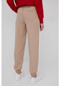 TOMMY HILFIGER - Tommy Hilfiger spodnie damskie kolor beżowy gładkie. Kolor: beżowy. Materiał: tkanina, poliester. Wzór: gładki #5