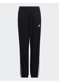 Adidas - adidas Spodnie dresowe Essentials 3-Stripes Woven Tracksuit Bottoms HR6334 Czarny Slim Fit. Kolor: czarny. Materiał: syntetyk #1