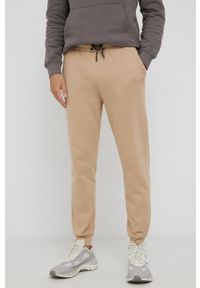 Guess Spodnie bawełniane męskie kolor beżowy gładkie. Kolor: beżowy. Materiał: bawełna. Wzór: gładki
