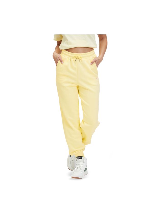 Fila - Spodnie damskie FILA Buetzow. Kolor: żółty. Materiał: dresówka