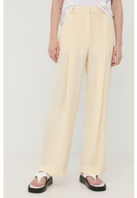 VICTORIA BECKHAM - Victoria Beckham spodnie jedwabne damskie kolor beżowy szerokie high waist. Stan: podwyższony. Kolor: beżowy. Materiał: jedwab