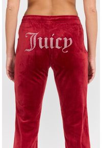 Juicy Couture - JUICY COUTURE Damskie czerwone spodnie dresowe Tina Track Pant. Kolor: czerwony. Materiał: dresówka. Długość: długie