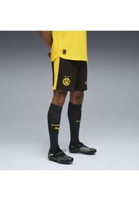 Puma - Męskie szorty Borussia Dortmund 25/26 PUMA Black Faster Yellow. Kolor: czarny, wielokolorowy, żółty. Materiał: tkanina. Sport: fitness, piłka nożna