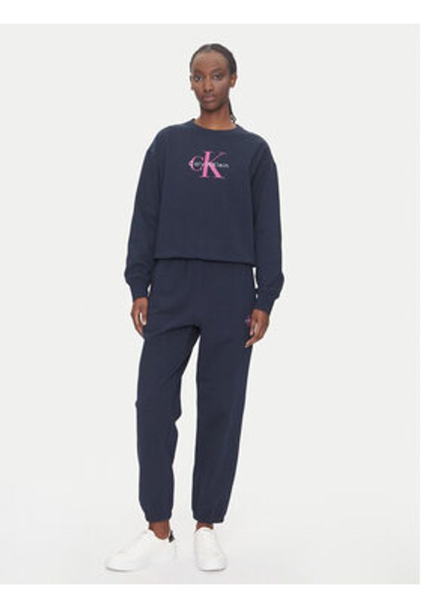 Calvin Klein Jeans Spodnie dresowe Monologo LV047B235G Granatowy Regular Fit. Kolor: niebieski. Materiał: bawełna