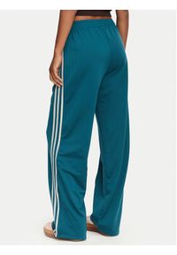 Adidas - adidas Spodnie dresowe Firebird Loose Tracksuit KS4672 Turkusowy Loose Fit. Kolor: turkusowy. Materiał: syntetyk #4