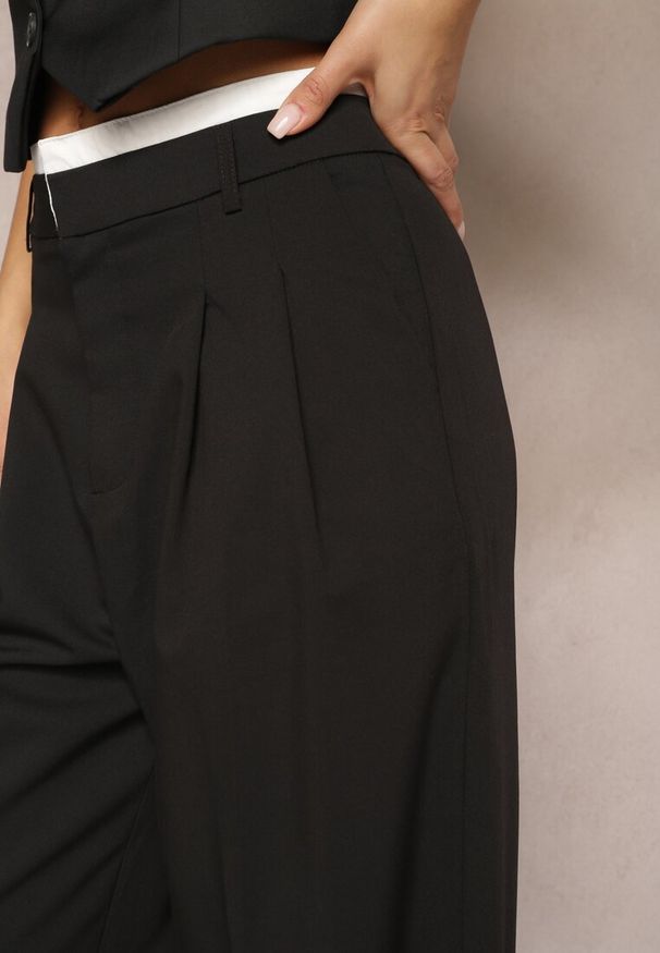 Renee - Czarne Spodnie z Szerokimi Nogawkami w Kant Kavina. Okazja: na co dzień. Stan: podwyższony. Kolor: czarny. Materiał: wiskoza. Styl: klasyczny, casual, elegancki