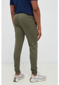 Under Armour spodnie męskie kolor zielony gładkie 1361642-001. Kolor: zielony. Materiał: dzianina. Wzór: gładki #2