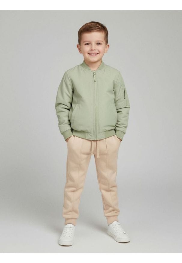 Sinsay - Spodnie jogger z przeszyciami - beżowy. Kolor: beżowy