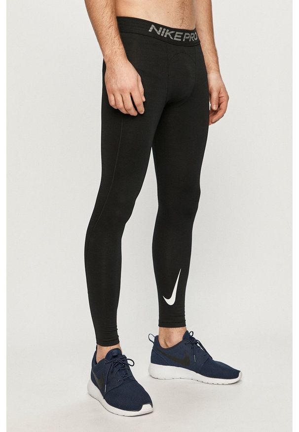 Nike - Legginsy. Kolor: czarny. Materiał: tkanina, włókno, dzianina, skóra. Technologia: Dri-Fit (Nike)