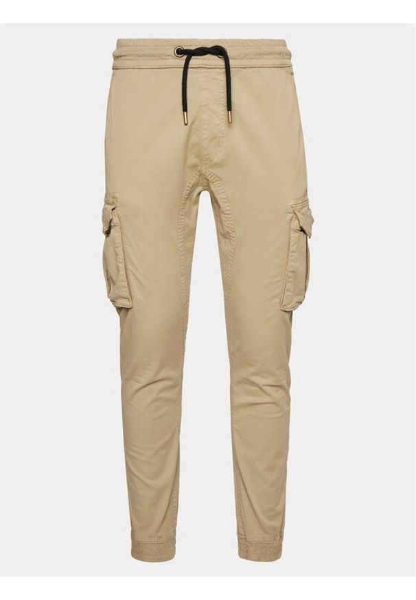 Alpha Industries Joggery Twill 116202 Beżowy Slim Taper Fit. Kolor: beżowy. Materiał: bawełna