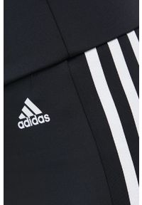 Adidas - adidas legginsy treningowe damskie kolor czarny gładkie. Kolor: czarny. Materiał: materiał, poliester, skóra. Wzór: gładki. Sport: fitness